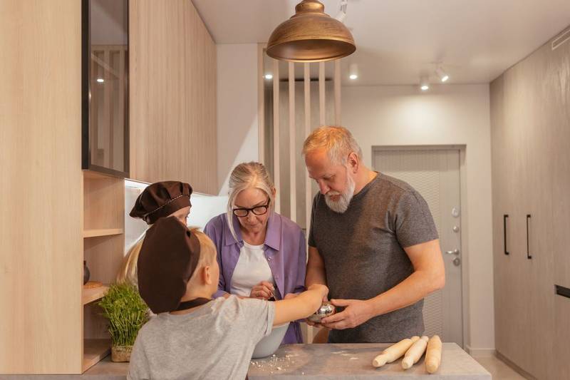 A family cooking together in a kitchen